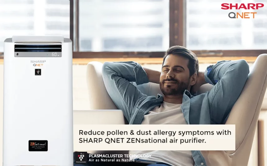 A young man breathing purified air with SHARP QNET ZENsational air purifier in the frame