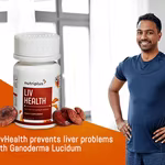 A young man smiling in an indoor setting with Ganoderma lucidum and Nutriplus LivHealth in the frame