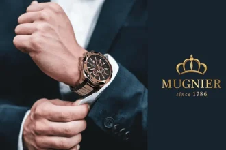A young man in a suit wearing Mugnier watch