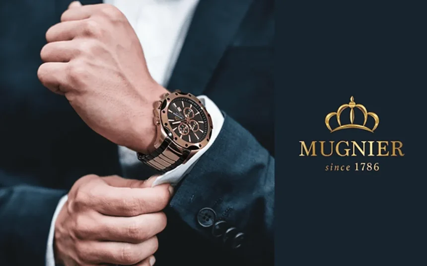 A young man in a suit wearing Mugnier watch