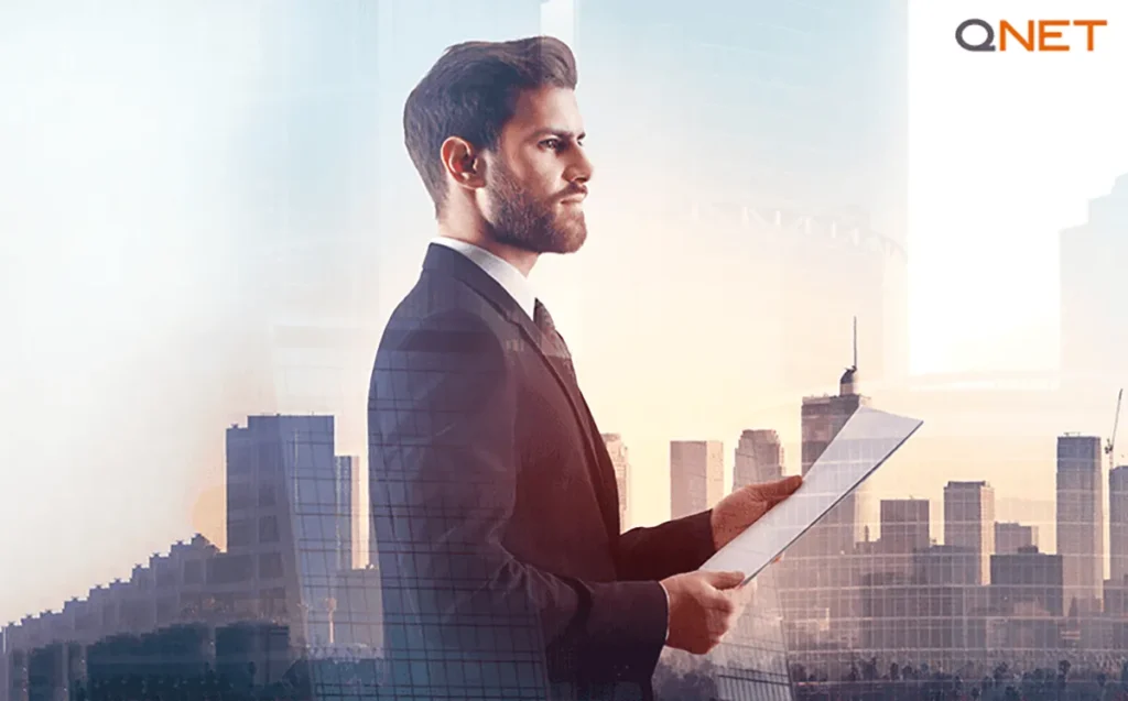 A young businessman standing outdoors depicting leadership lessons for QNET entrepreneurs