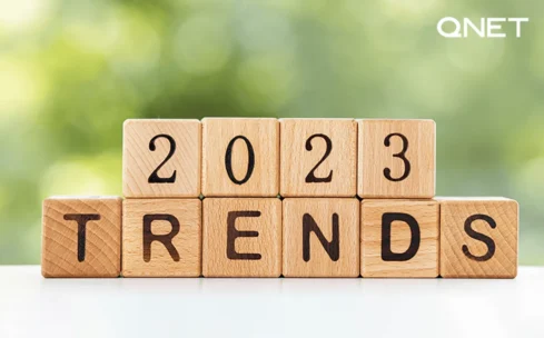 text image with 2023 trends in wooden blocks