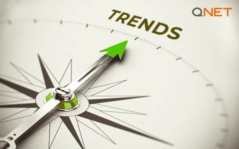 compass pointer pointing at trends with qnet logo