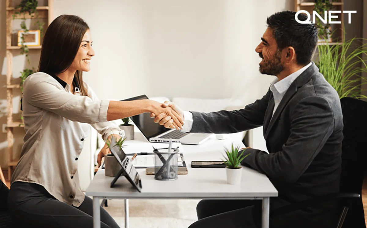 man and woman in interview