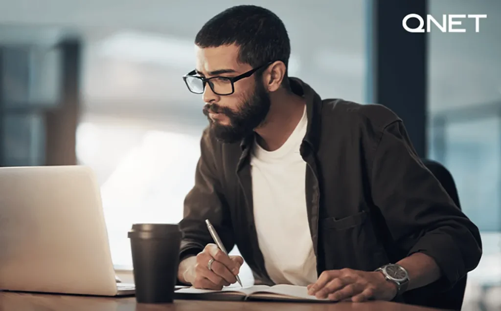 An entrepreneur looking at data on laptop to make an informed decision