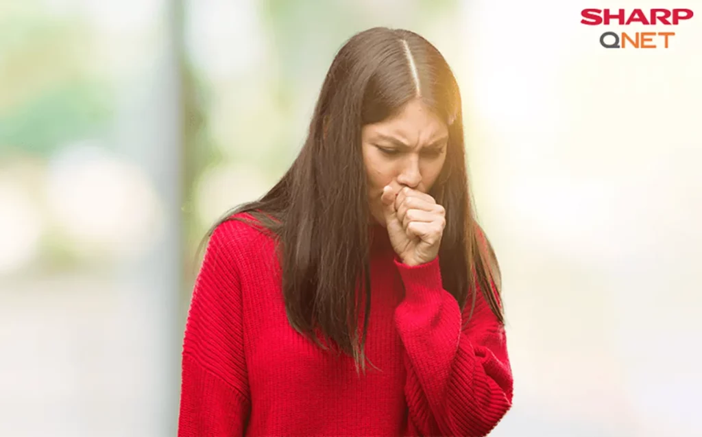 An Indian woman coughing and experiencing breathing problems due to the inhalation of mold