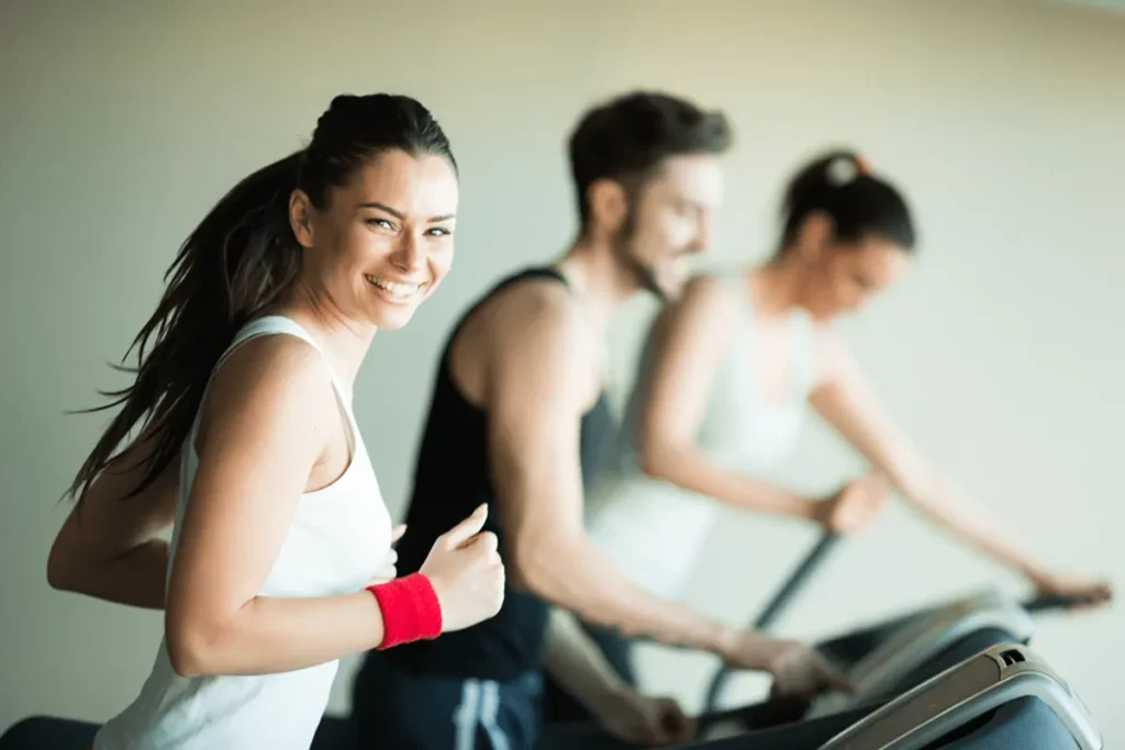 Smiling woman on a treadmill